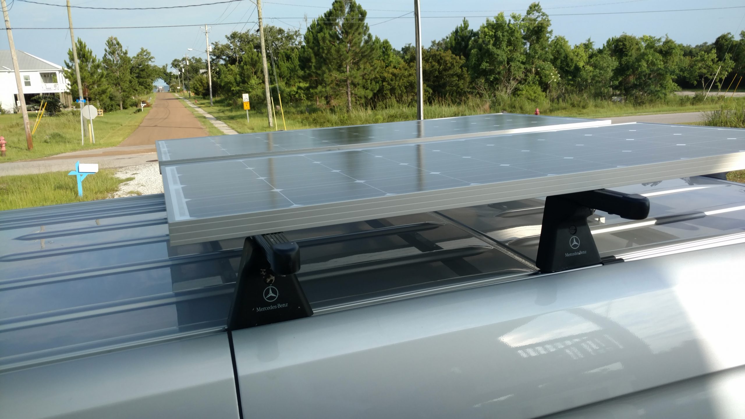 Solar panels on a roof rack can be cooler since there is 4 inches between roof and panel.